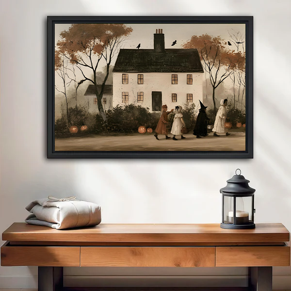Vintage Halloween house canvas wall art above a white bed, showing costumed figures and pumpkins.