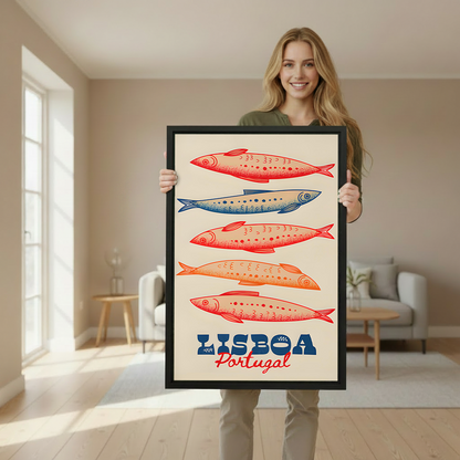 Woman holding a large framed vintage Lisboa Portugal sardine art print to demonstrate print size in a bright Scandinavian-style interior