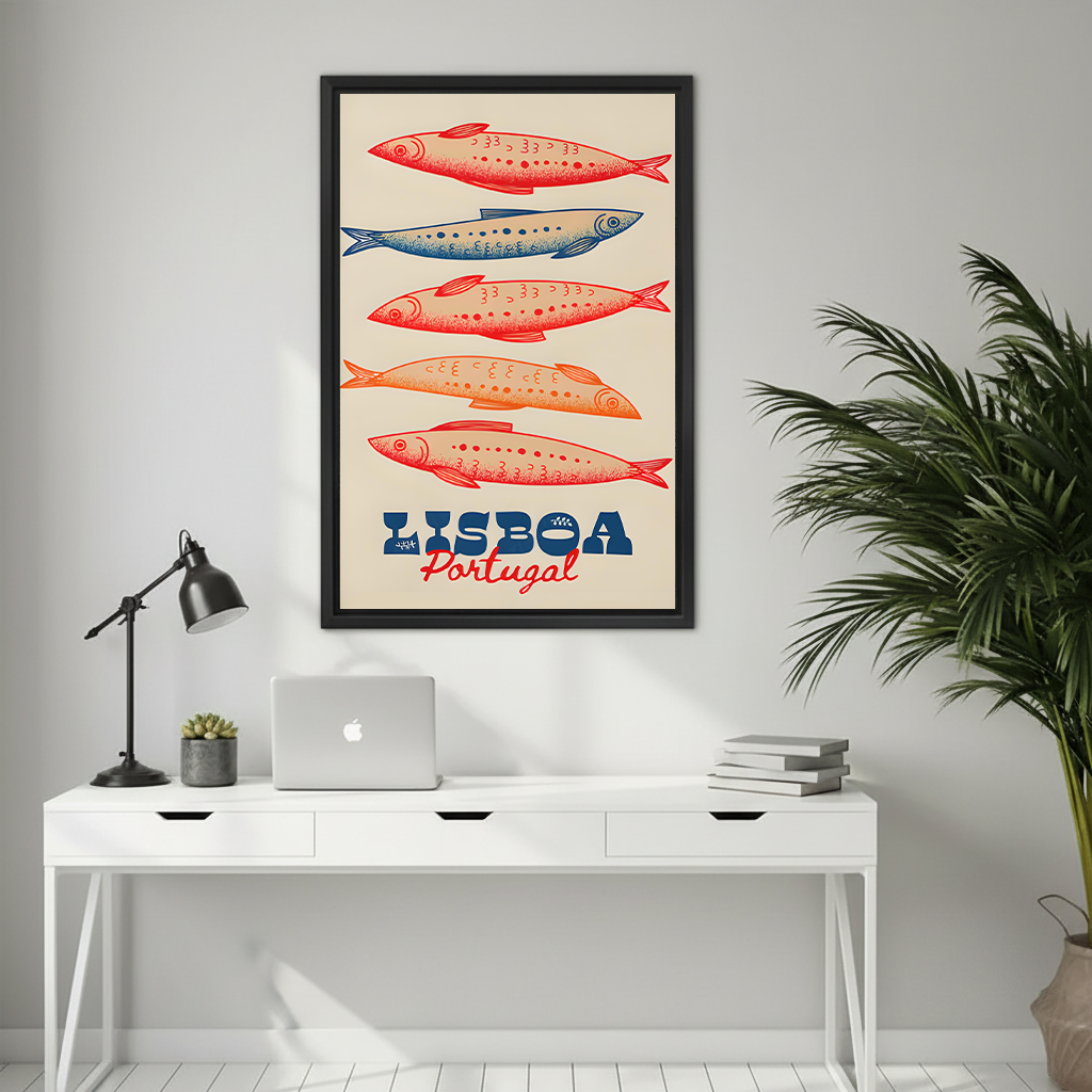 Framed vintage Lisboa Portugal sardine wall art displayed above a white desk with a laptop and lamp in a minimalist home office