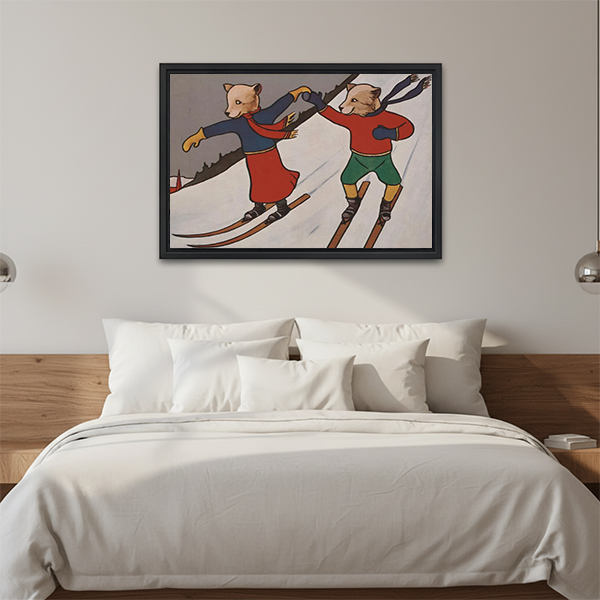 Framed skiing animals canvas wall art featuring colorful winter outfits above a bed with white pillows and bedding.