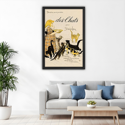 Framed vintage Steinlen cat wall art decorating a living room above a grey sofa