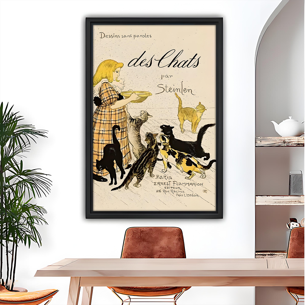 Vintage Steinlen cat wall art in black frame above a wooden dining table