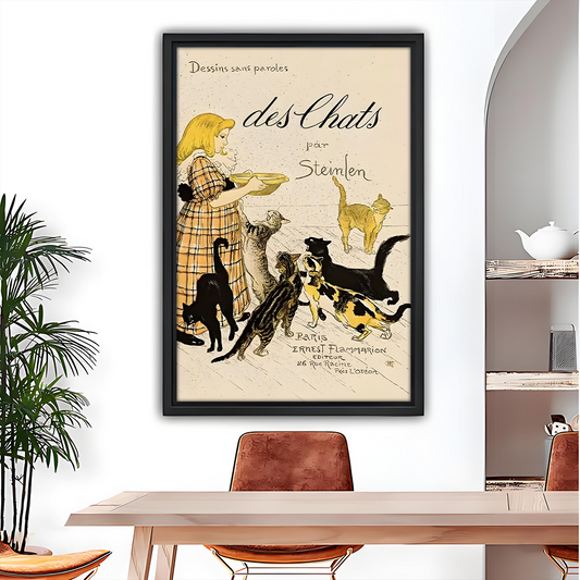 Vintage Steinlen cat wall art in black frame above a wooden dining table