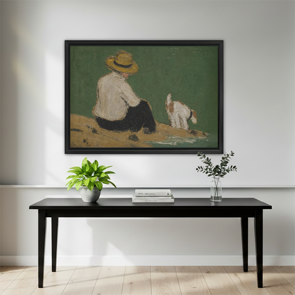 Framed vintage boy and dog waterside wall art mounted above a black dining table with minimalist green plant decor