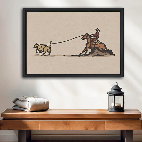 Framed vintage western cowboy roping wall art displayed above an entryway console table