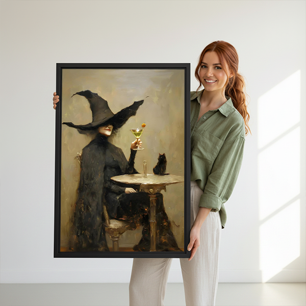 Vintage witch martini and black cat canvas wall art framed in black above a cream sofa and oval table