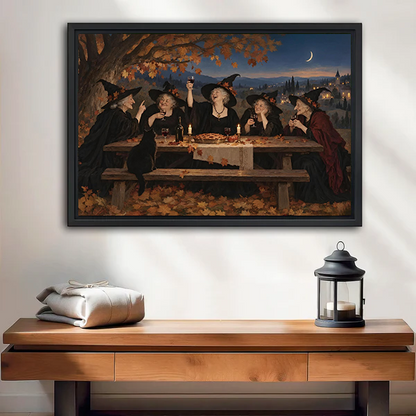 Vintage witches feast canvas wall art in a black frame above a cream sofa, depicting five witches at dusk.