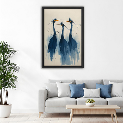 Watercolor blue herons trio framed canvas wall art above a white sofa with blue cushions in a bright minimalist living room with palm plant