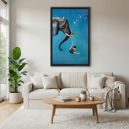 Black framed watercolor sandpiper bird canvas wall art hung above a cream sofa in a Scandinavian living room