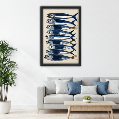 Watercolor sardine fish framed canvas print on white wall above gray sofa with blue pillows in modern living room