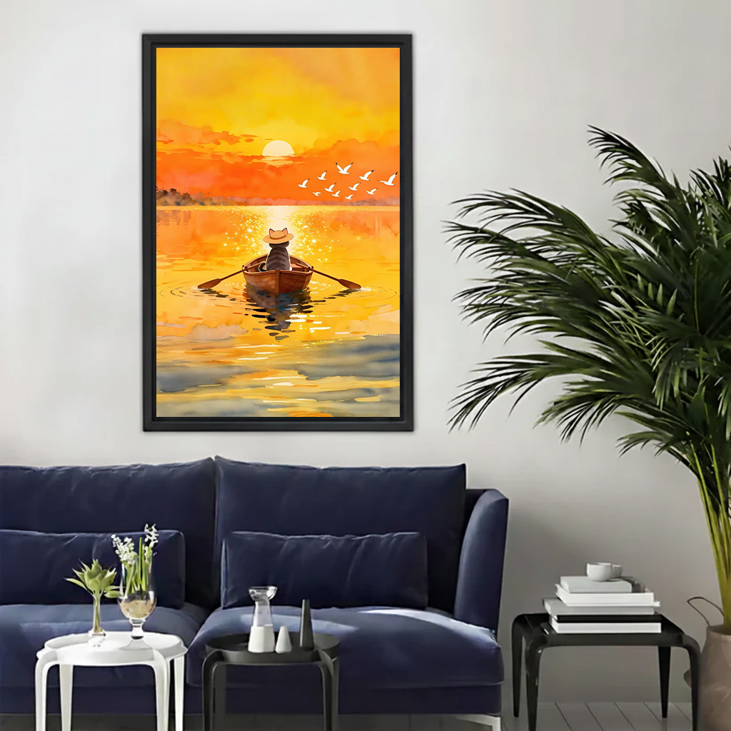 Watercolour cat sunset rowing canvas wall art in black float frame displayed above a navy blue sofa in a modern living room