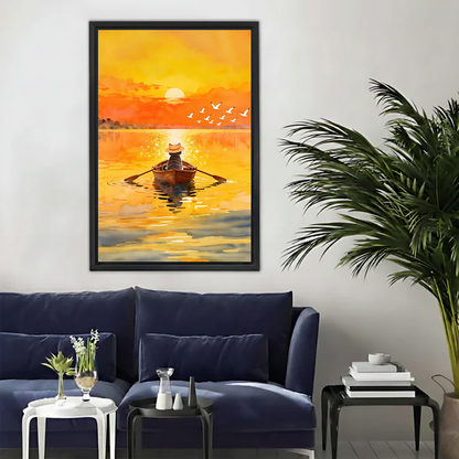 Watercolour cat sunset rowing canvas wall art in black float frame displayed above a navy blue sofa in a modern living room