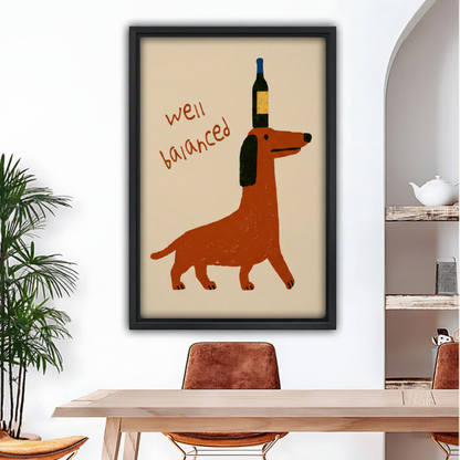 Funny dachshund balancing wine bottle framed wall art above wooden dining table, humorous dog print for kitchen decor