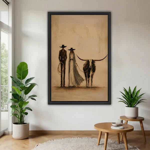 Western couple and longhorn canvas wall art displayed without a front frame between potted plants.