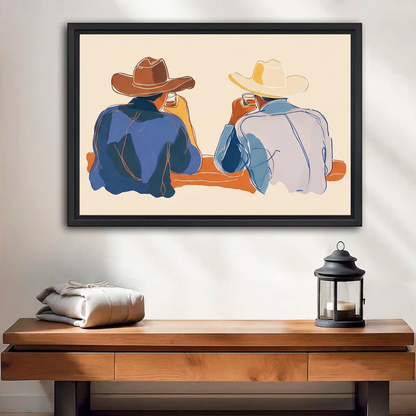 Black-framed western cowboy duo wall art above a wooden bench beside folded blankets and a candle lantern.