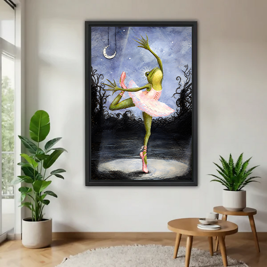 Framed whimsical ballerina frog canvas wall art above a neutral living room sofa