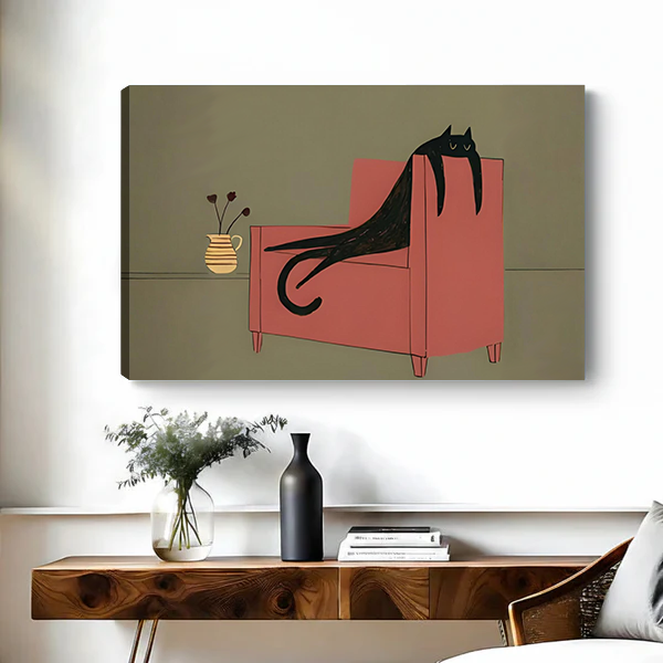Framed whimsical black cat canvas wall art above a wooden console with flowers, books, and a black vase.
