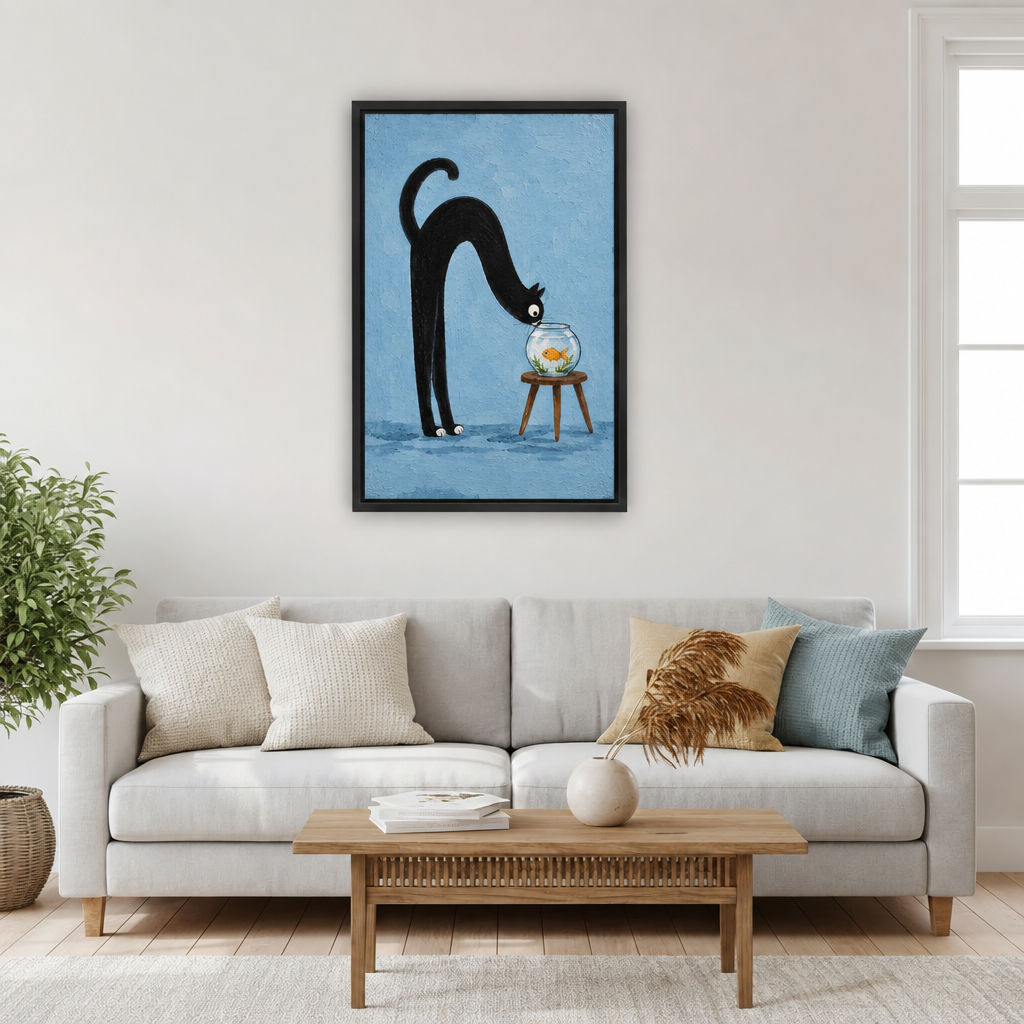 Framed whimsical black cat goldfish canvas wall art hanging over a light gray sofa and wooden coffee table