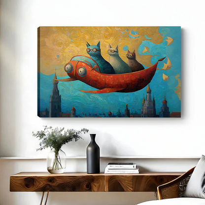 Canvas art print of three whimsical cats on a red flying fish soaring above fantasy castle spires in a golden blue sky, displayed above a wooden console table