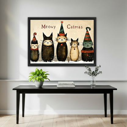 Framed Christmas cats wall art over a black entry table styled with a green plant and books
