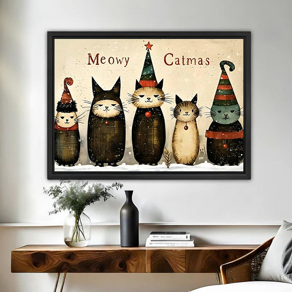 Framed Christmas cats canvas wall art above a walnut console with dried stems and a matte black vase