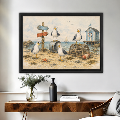 Black-framed whimsical coastal seagulls canvas wall art above a wooden console with vases and stacked books.