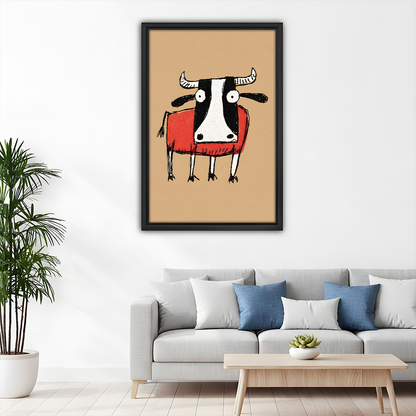 Framed quirky cow canvas wall art above a grey sofa in a minimalist living room, warm earthy tones and folk art charm