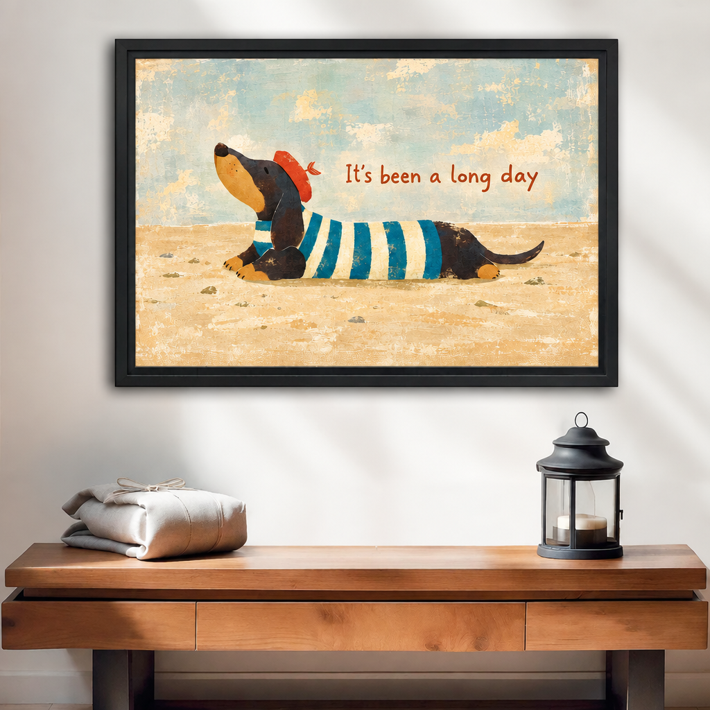 Whimsical dachshund canvas wall art in a black frame above a wooden console, showing a dog in a striped shirt.