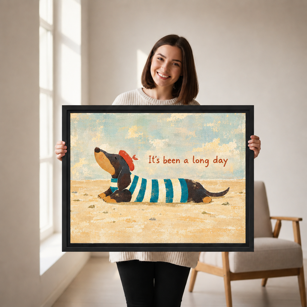 Woman holding black framed whimsical dachshund canvas wall art with the words “It’s been a long day.”