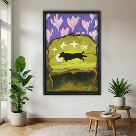 Whimsical black dachshund folk art floral wall print in black frame, displayed in minimalist entryway with green plants and round side table