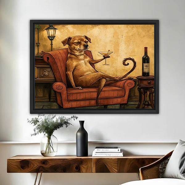 Framed whimsical dog cocktail canvas wall art above a wooden console with flowers and a black vase.