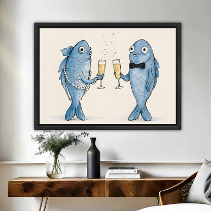 Whimsical fish toast canvas wall art in a black frame above a wooden console, with two blue fish raising glasses.