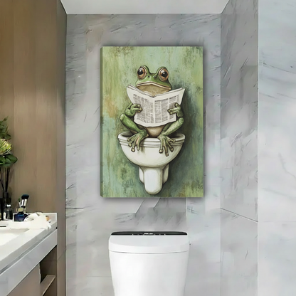 Whimsical frog bathroom canvas wall art shown as an unframed canvas above a toilet in a marble bathroom