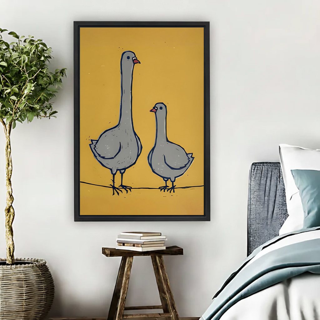 Whimsical goose pair canvas wall art held by a woman, featuring two gray geese against a mustard yellow background.
