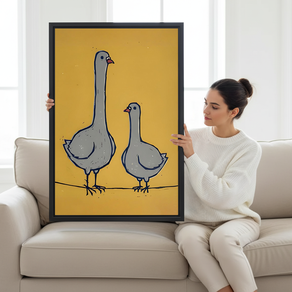 Framed whimsical goose pair canvas wall art above a white sofa, with two gray geese and bold mustard color.