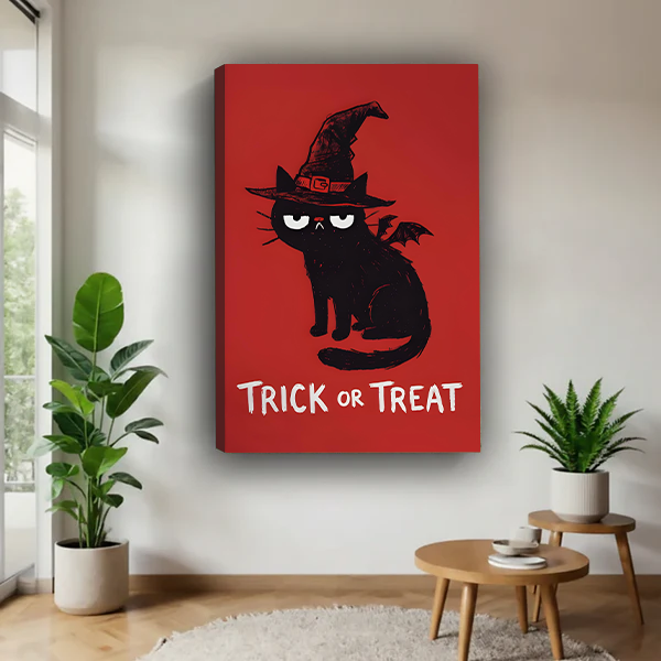 Framed Halloween cat canvas wall art hangs above a bed, featuring a black witch cat and bold Trick or Treat lettering.