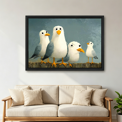 Black-framed seagulls canvas wall art showing four cartoon-style coastal birds above a wooden console beside a lantern.