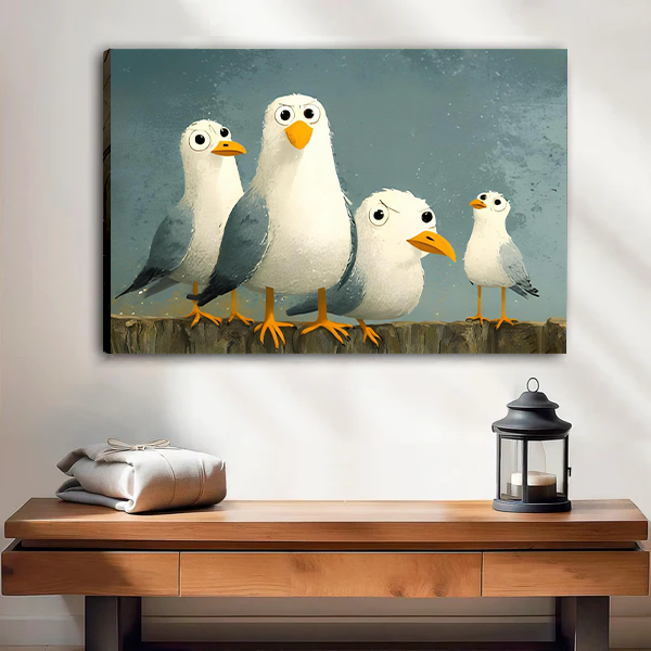 Woman holding black-framed whimsical seagulls canvas wall art with four wide-eyed birds against a blue-gray background.