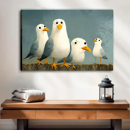 Woman holding black-framed whimsical seagulls canvas wall art with four wide-eyed birds against a blue-gray background.