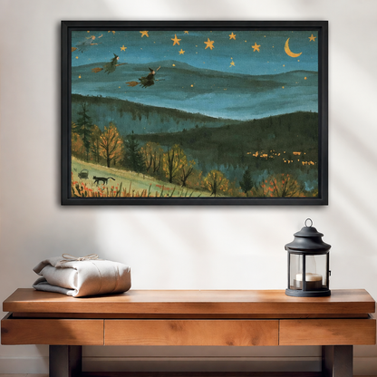 Framed whimsical starry mountain canvas wall art above a wooden console, with a crescent moon and layered hills.