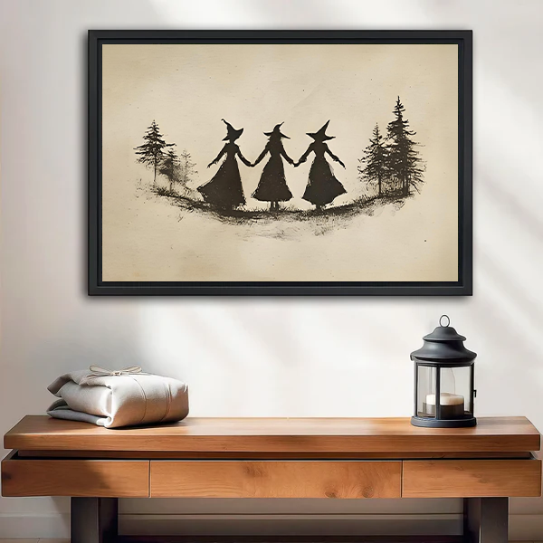 Whimsical witch trio canvas wall art displayed above a wooden console with a lantern.
