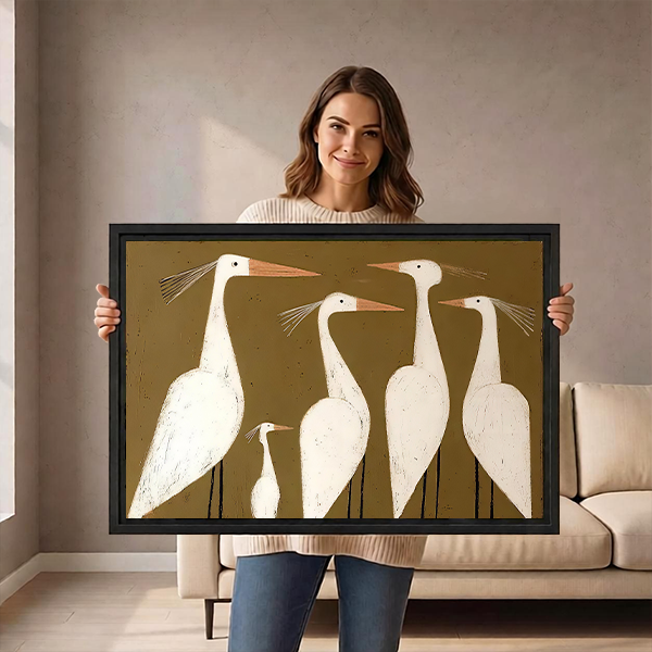 Black-framed white egrets canvas wall art in a modern folk style displayed above a wooden console with vases.