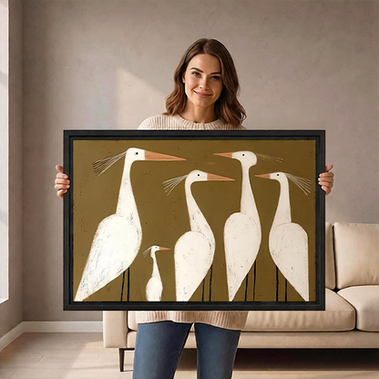 Black-framed white egrets canvas wall art in a modern folk style displayed above a wooden console with vases.