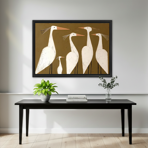 Framed white egrets canvas wall art showing four tall birds and one small bird displayed above a dark bed.