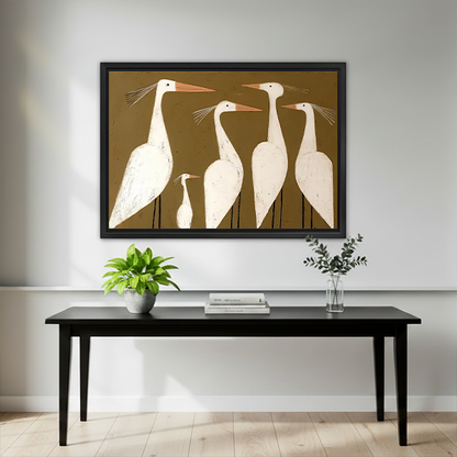 Framed white egrets canvas wall art showing four tall birds and one small bird displayed above a dark bed.