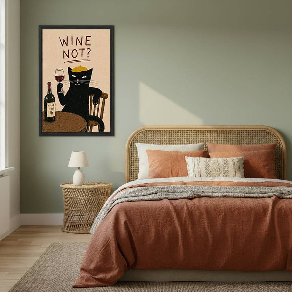 Wine not black cat gold beret wine glass bottle sandy background retro poster black framed canvas wall art on sage green wall beside wide rattan arched headboard bed with terracotta linen and wicker round nightstand