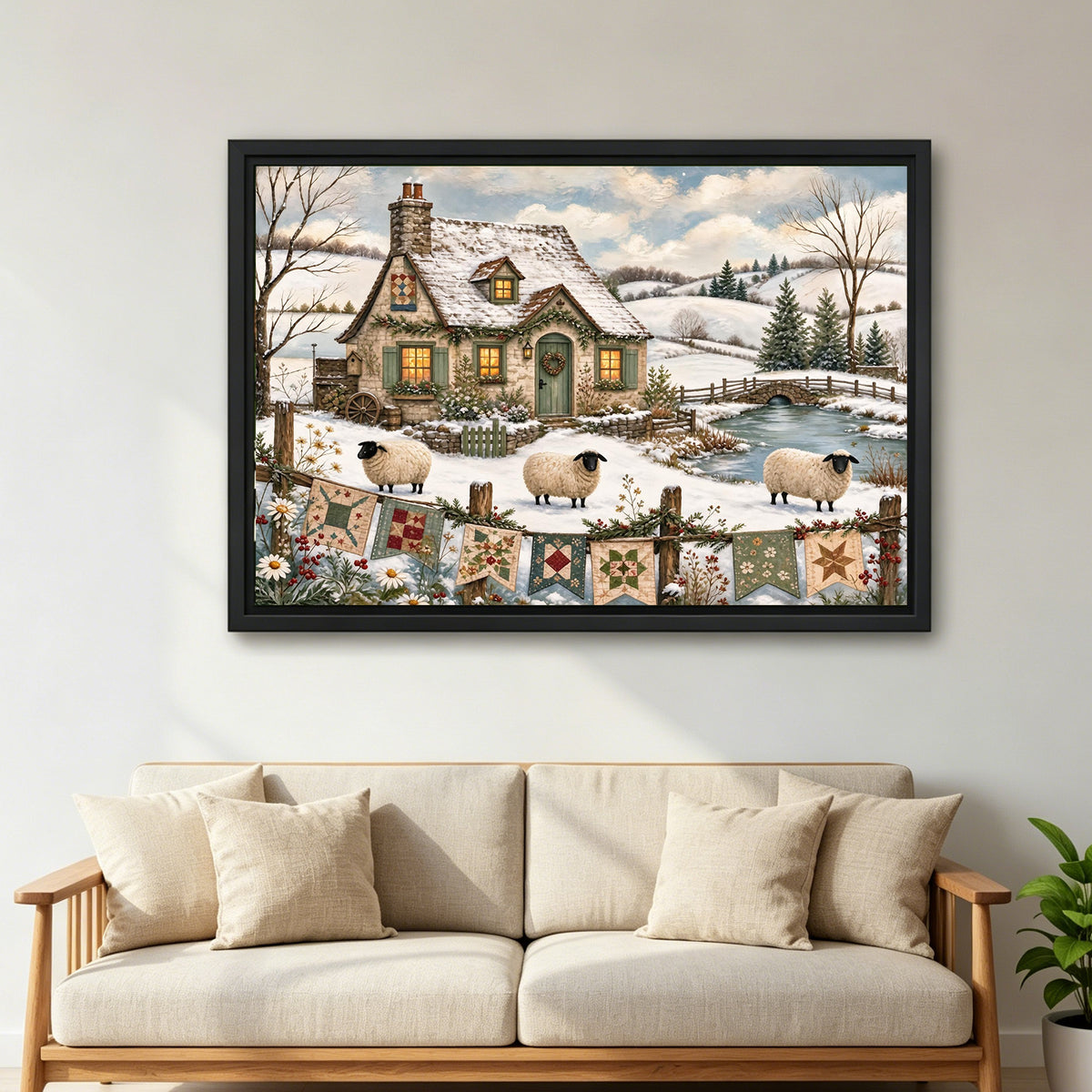 Large framed winter cottage sheep canvas wall art displayed above a cream sofa in a bright living room