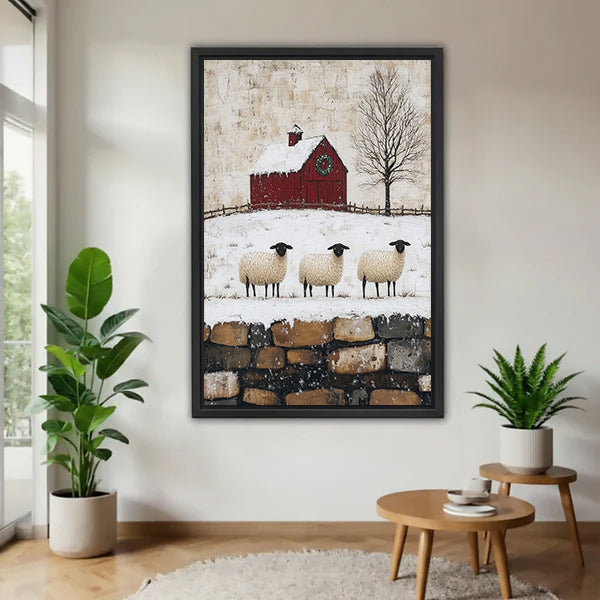 Black-framed winter sheep and red barn canvas wall art displayed between potted plants.