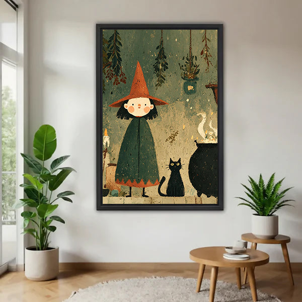 Black-framed witch and black cat canvas wall art displayed between potted plants