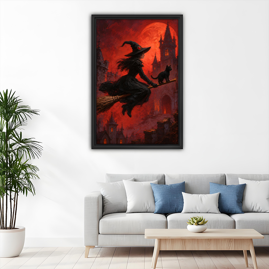 Witch and black cat canvas wall art in a black frame held by a woman for scale.